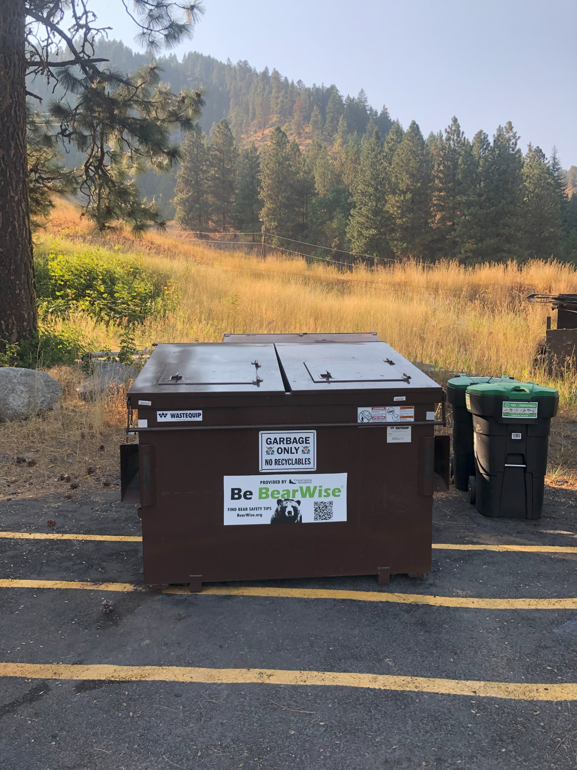 Conservation Northwest installs new bear-resistant dumpster at